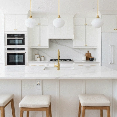 Modern luxury kitchen renovation with marble countertops and gold fixtures
